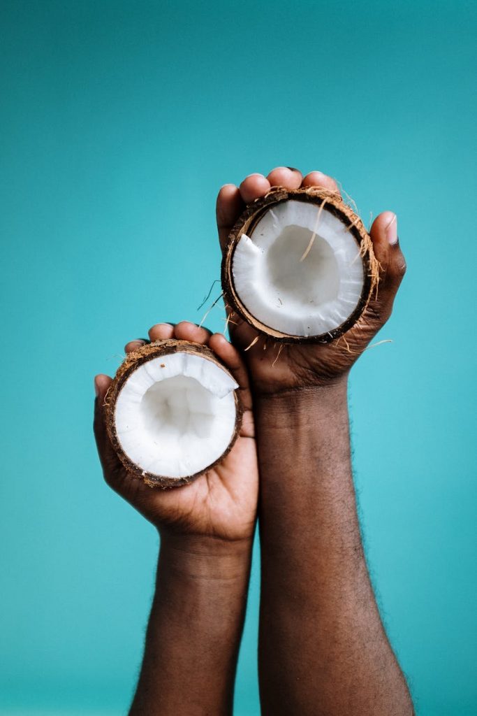 photo of person holding coconut